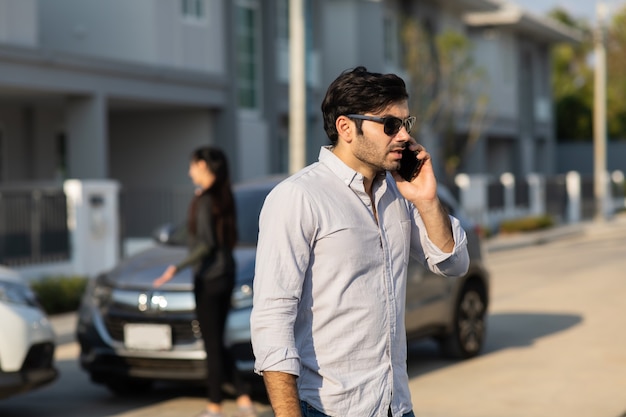 Caucasian Woman Driver Making Phone Call To Insurance Agent After Traffic Accident. Accident. Car insurance an non-life insurance concept.