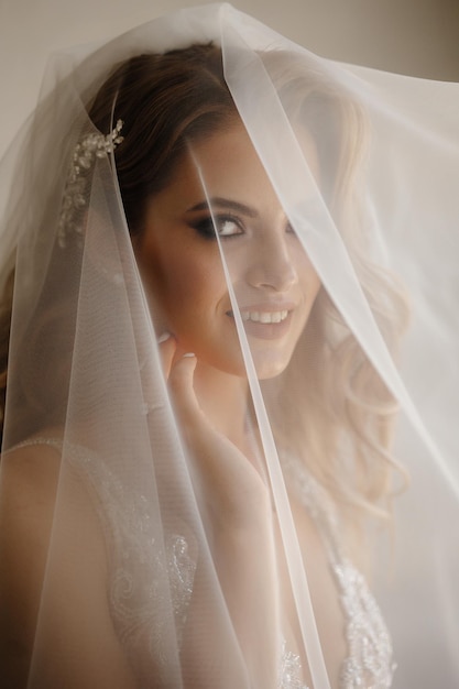 Caucasian Woman Hidden behind Traditional Bridal Veil