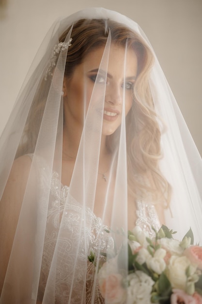 Caucasian Woman Hidden behind Traditional Bridal Veil