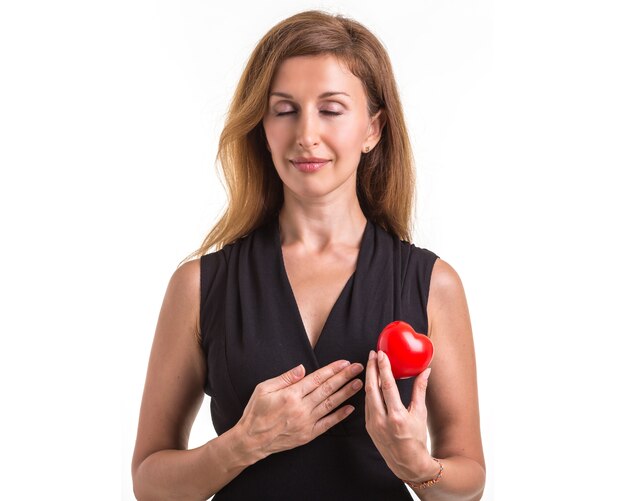 Caucasian woman holding red heart