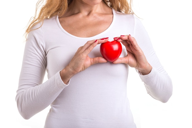 Caucasian woman holding red heart