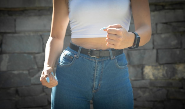 Caucasian young woman threatening with fist