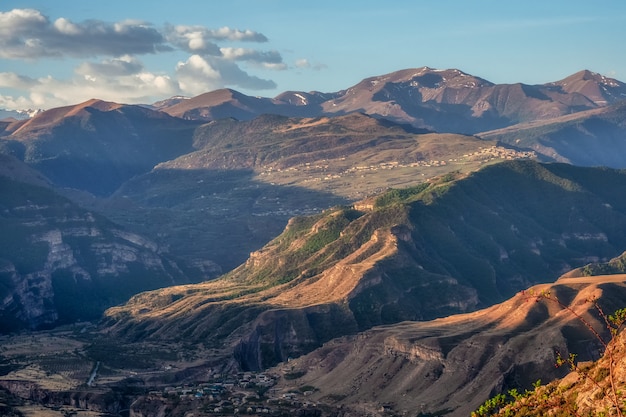 Caucasus mountains at dawn Atmospheric landscape with silhouettes of mountains