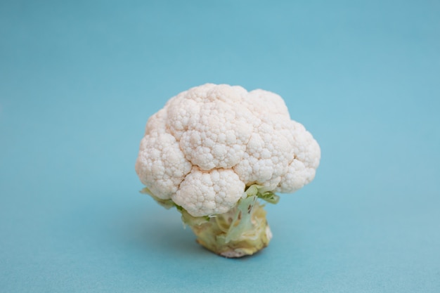 Cauliflower on blue table side view