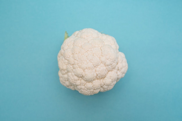 Cauliflower on blue table top view