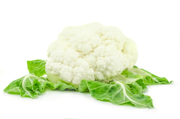 Cauliflower with green leaves isolated on white