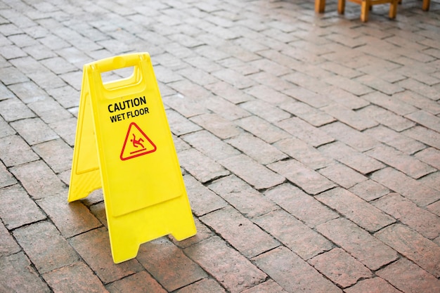 Caution wet floor sign on the floor