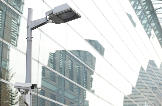 CCTV security camera lamp pole in the city