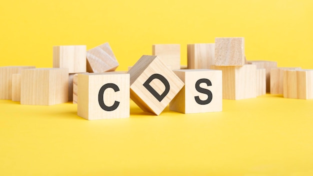 CDS Credit Default Swap concept three wooden blocks with lettter