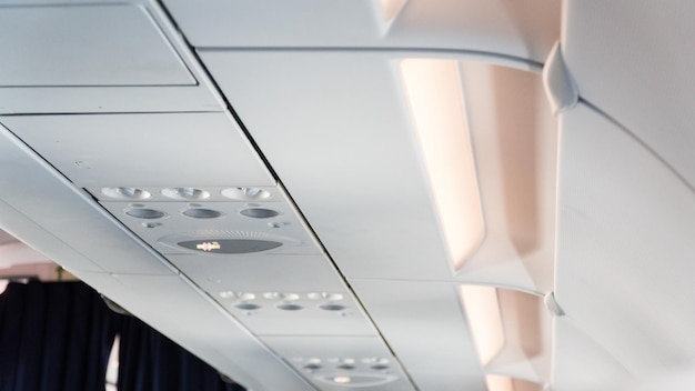 Ceiling of the airplane with luggage compartment. Aircraft interior