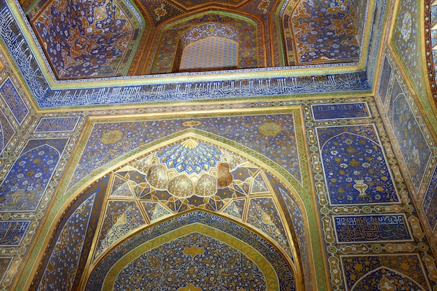 Ceiling decorated with gold and mosaics inside the Sherdor Madrasah, the Ulugbek on Registan Square in Samarkand. 29.04.2019