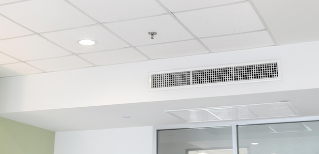 Ceiling mounted cassette type air conditioner and modern lamp light on white ceiling duct air conditioner for home or office