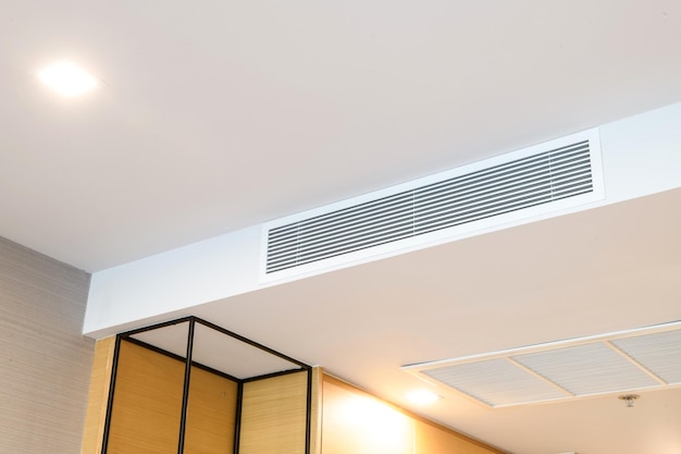 Ceiling mounted cassette type air conditioner and modern lamp light on white ceiling duct air conditioner for home or office