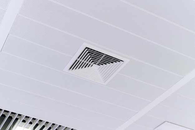 Ceiling mounted cassette type air conditioner and modern lamp light on white ceiling duct air conditioner for home or office