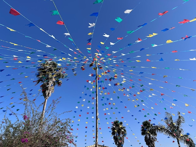 Celebration of the Brazilian Festa Junina Festa Junina theme with little flags and the blue sky