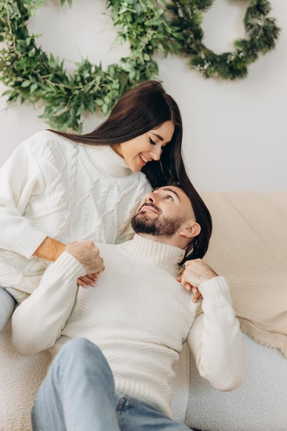 Celebration fun and holidays concept happy couple wearing ugly sweaters