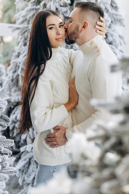 Celebration fun and holidays concept happy couple wearing ugly sweaters