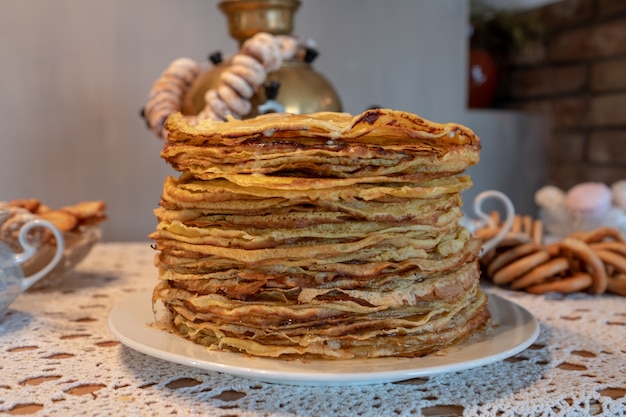 Celebration of Maslenitsa with pancakes and tea from a samovar