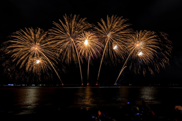 Celebrations firework at night on the sea pattaya city Thailand 