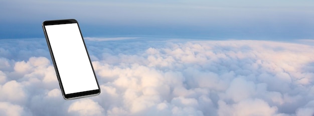 Cell phone floating in the clouds