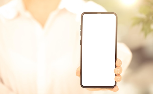 Cell phone mockup woman in white clothes shows blank white cell phone screen Mobile phone with white screen in female hand