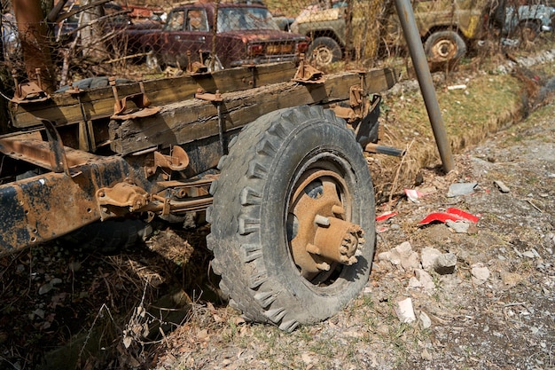 Cemetery for old cars in the courtyard on the outskirts