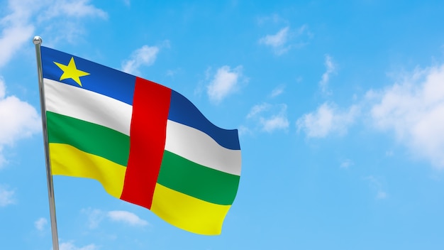 Central African Republic flag on pole. Blue sky. National flag of Central African Republic