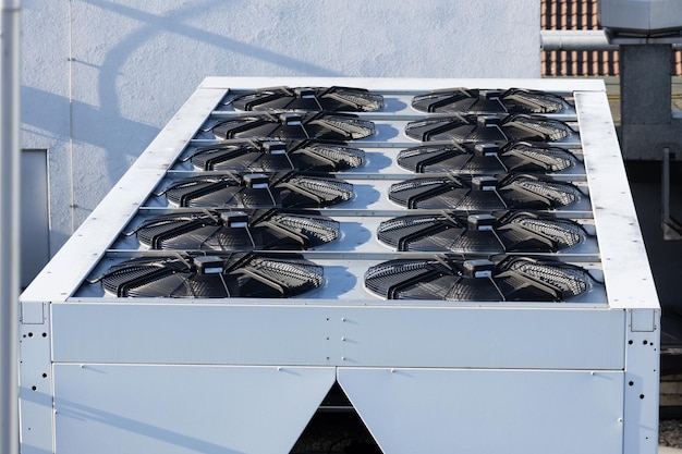 Central air conditioning system on the roof of the building large shafts for ventilation and cooling of the house