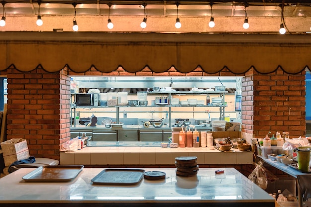 Central kitchen with stainless shelf counter bar kitchenware ingredient raw material at the restaurant