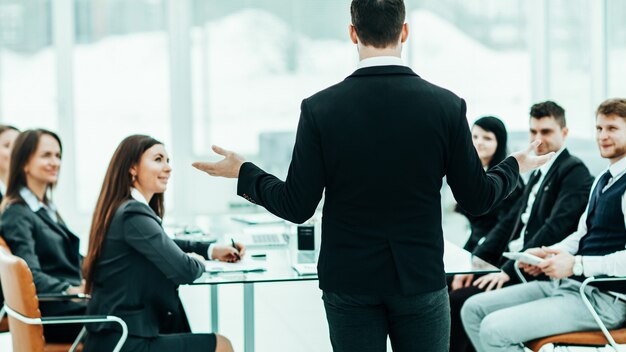 CEO speaks at the workshop business team in a modern office. the photo has a empty space for your text.