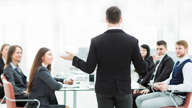 Ceo speaks at the workshop business team in a modern office