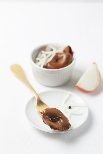 Ceramic bowls with canned mushrooms.