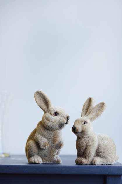 Ceramic easter hares vintage figurine rabbit on a gray wall background