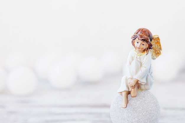 Ceramic figure of angel on light.