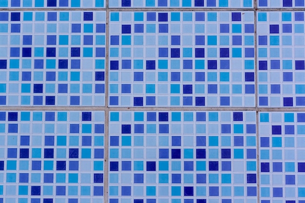 Ceramic tiles on bottom of pool in blue colors Horizontal