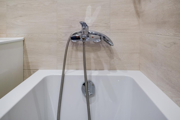 Ceramic water tap sink with faucet with soap and shampoo dispensers in expensive bathroom