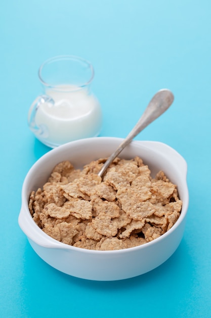 Cereals in white bowl with milk