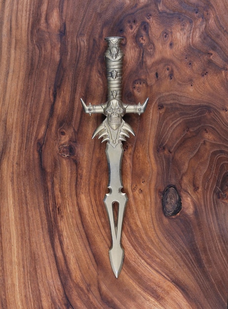 ceremonial dagger on wooden background