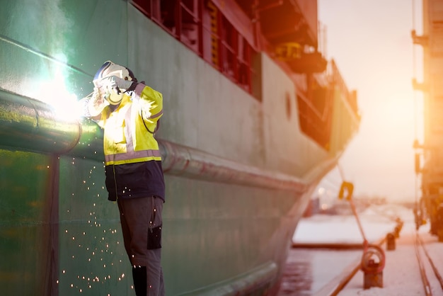 Certified Welder Technician Wearing The Protective Clothes And Equipment Working With A Welding Tool