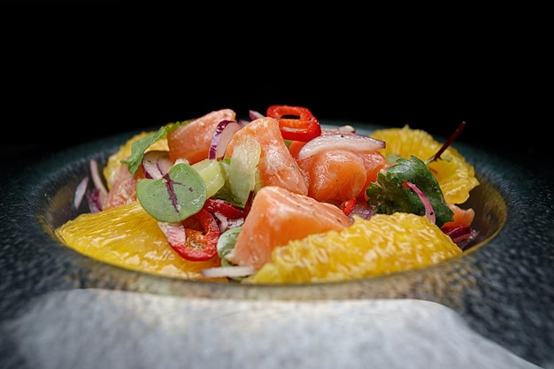 Ceviche with salmon oranges onions and herbs