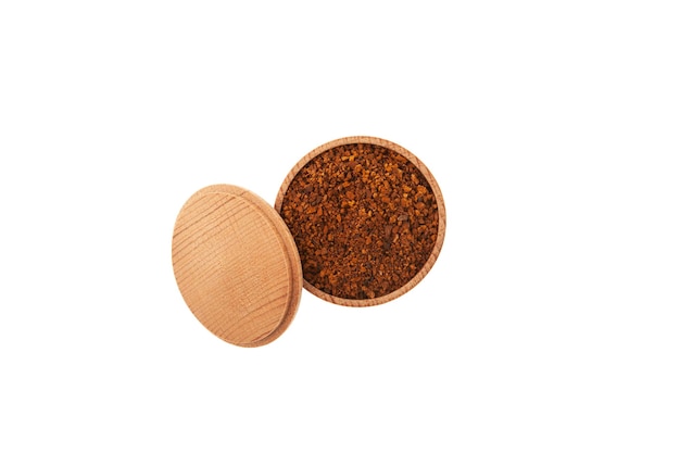 Chaga tea powder in wooden bowl on white background top view