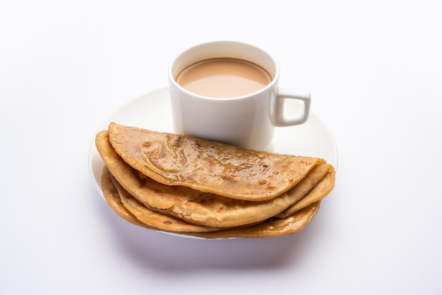 Chai Paratha Hot Tea served with Flatbread is a traditional simple meal from India and Pakistan