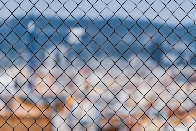 Chain link fence in a city