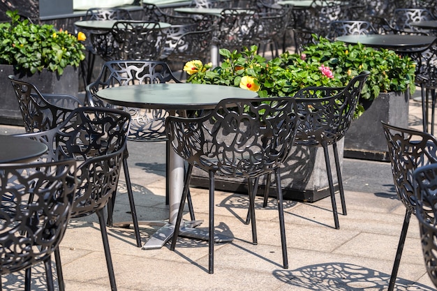 Chairs and table on the street cafe in downtown Ho Chi Minh city, Vietnam, close up