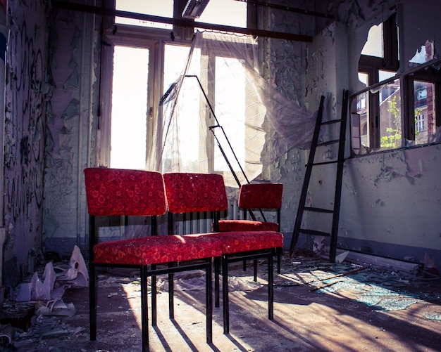 Photo chairs and tables in abandoned room