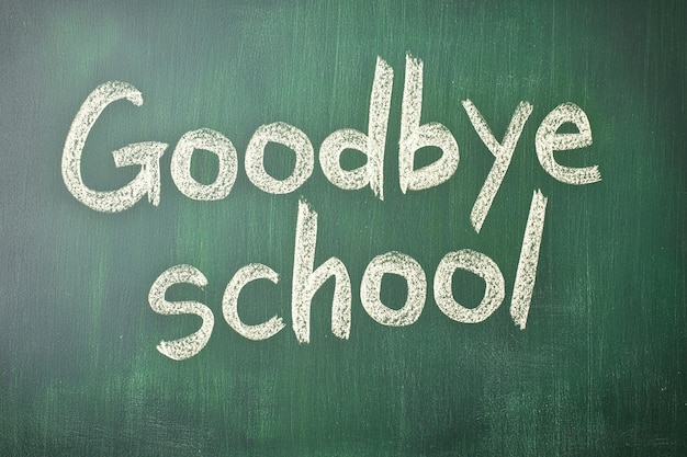 Photo chalk inscription goodbye school on a clean green board