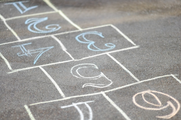 Chalk-painted hopscotch on asphalt