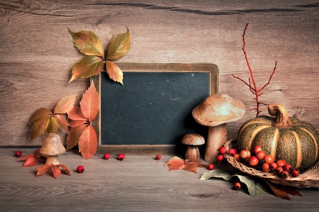 Chalkboard with space for your greeting text with Autumn decorations