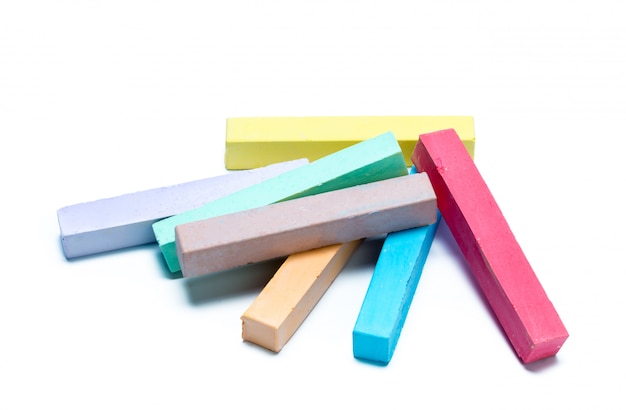 Chalks in a variety of colors arranged on a white background