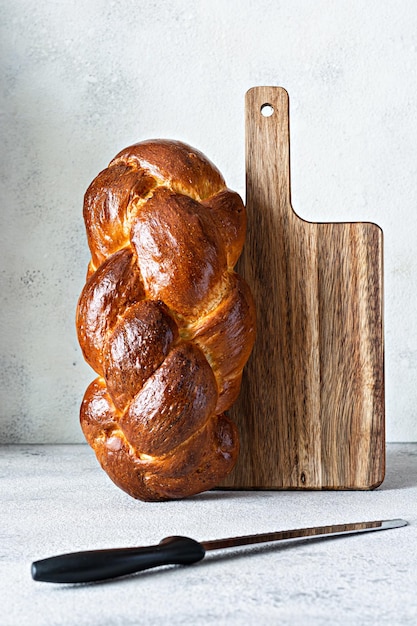 Challah or Hala is a traditional jewish sweet fresh sabbath Braided bread (loaf),  fresh bun